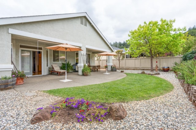 view of yard with a patio and fence