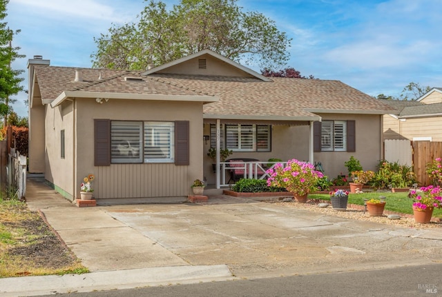 137 Webster St, Vallejo, CA 94591 - view of front of home featuring a shingled roof, stucco siding, fence, and a chimney