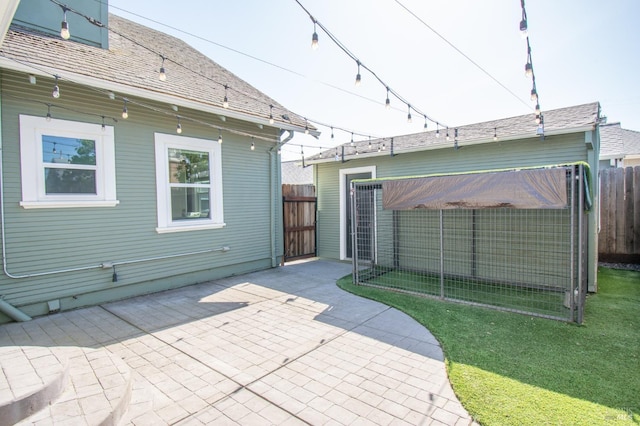 back of house with a yard, a patio area, and fence