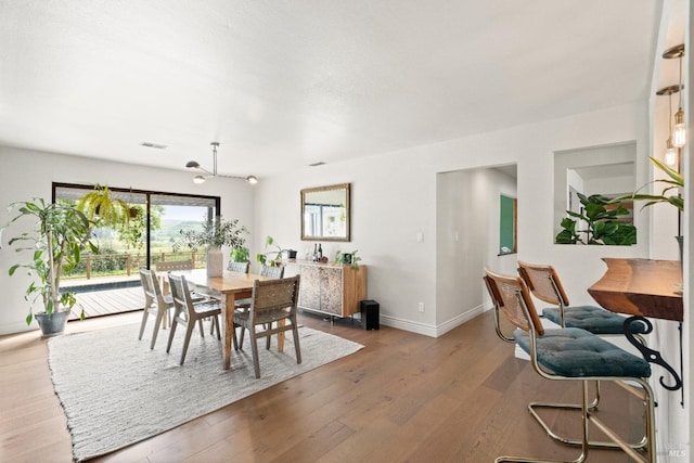 2265 Schaeffer Rd, Sebastopol, CA 95472 - dining area with visible vents, baseboards, and hardwood / wood-style floors