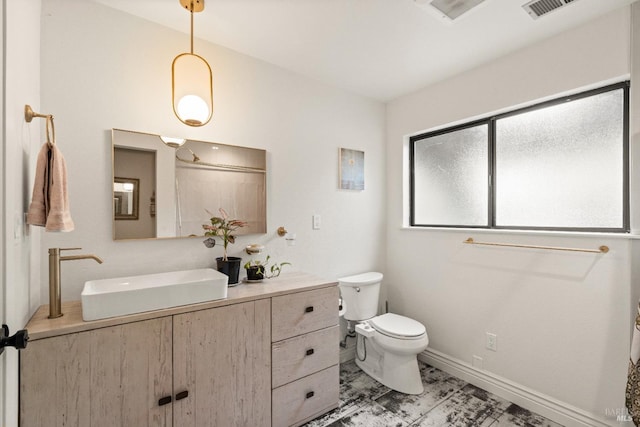 2265 Schaeffer Rd, Sebastopol, CA 95472 - full bath with toilet, marble finish floor, baseboards, visible vents, and vanity