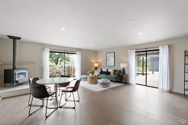2265 Schaeffer Rd, Sebastopol, CA 95472 - dining area featuring a wood stove, light wood finished floors, plenty of natural light, and recessed lighting
