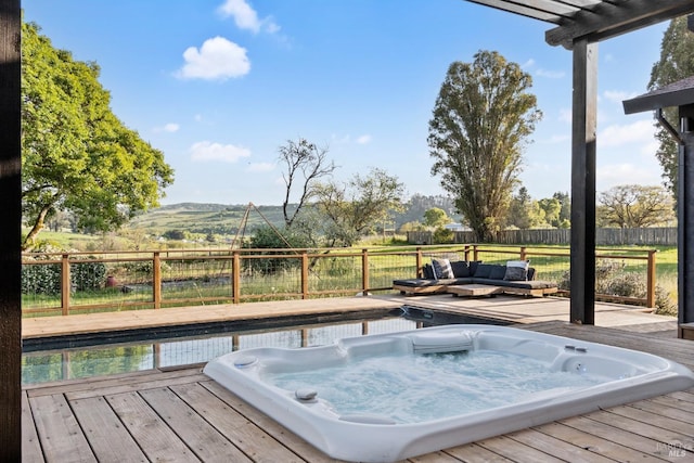 2265 Schaeffer Rd, Sebastopol, CA 95472 - deck with an outdoor hangout area, a mountain view, hot tub deck surround, and a fenced backyard