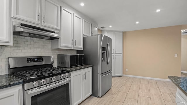 3087 Pecan Cir, Fairfield, CA 94533 - kitchen featuring under cabinet range hood, decorative backsplash, white cabinets, and appliances with stainless steel finishes