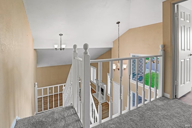 3087 Pecan Cir, Fairfield, CA 94533 - stairs featuring carpet, vaulted ceiling, baseboards, and a notable chandelier