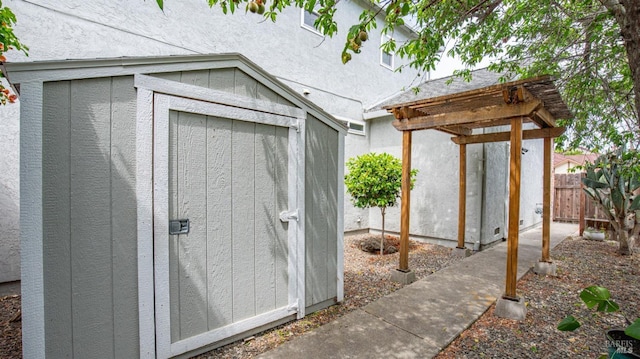 3087 Pecan Cir, Fairfield, CA 94533 - view of shed featuring a pergola and fence