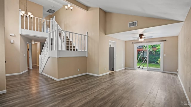 3087 Pecan Cir, Fairfield, CA 94533 - unfurnished living room with wood finished floors, ceiling fan with notable chandelier, high vaulted ceiling, visible vents, and stairway