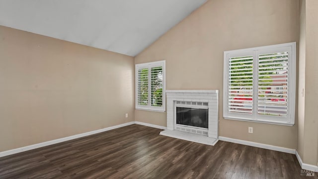 3087 Pecan Cir, Fairfield, CA 94533 - unfurnished living room with a brick fireplace, baseboards, high vaulted ceiling, and wood finished floors
