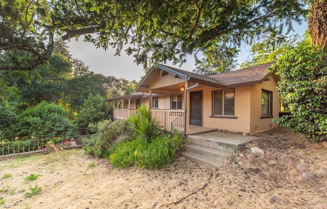 104 Rose Ln, Napa, CA 94574 - rear view of property with a porch, stucco siding, roof with shingles, and fence