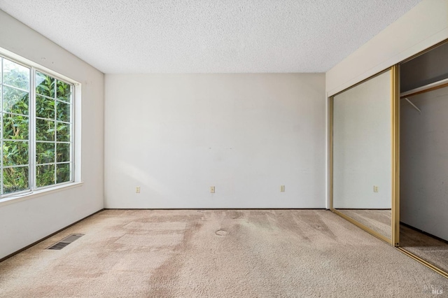 1722 Capella Ct, Petaluma, CA 94954 - unfurnished bedroom featuring carpet floors, a textured ceiling, and a closet