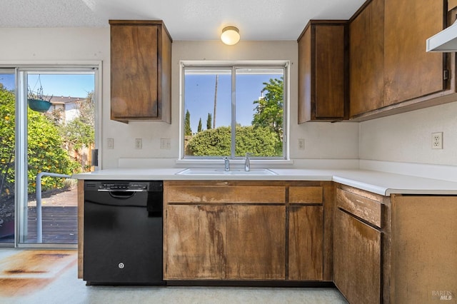 1722 Capella Ct, Petaluma, CA 94954 - kitchen with black dishwasher, a sink, range hood, and light countertops
