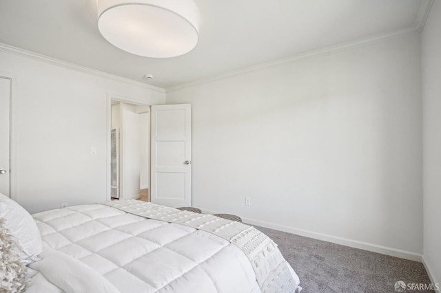 bedroom featuring carpet flooring, ornamental molding, and baseboards