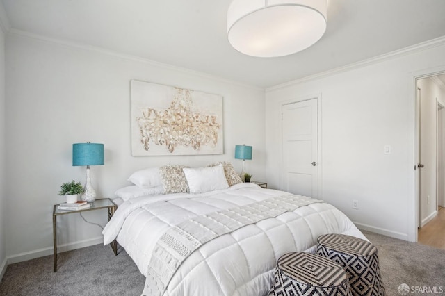 bedroom featuring carpet, ornamental molding, and baseboards