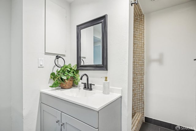 bathroom featuring vanity and a stall shower