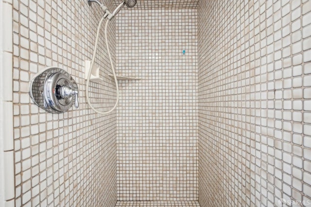 bathroom with tiled shower