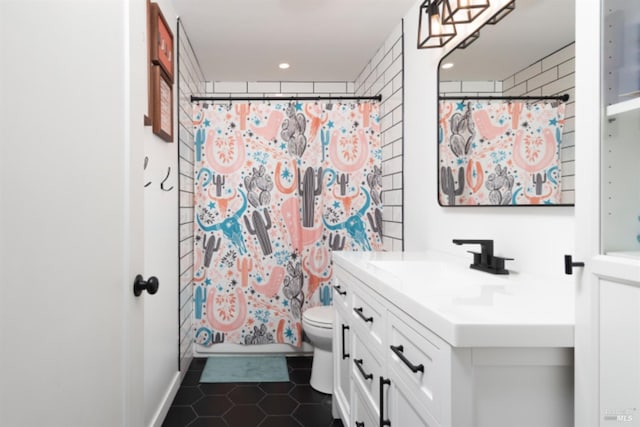 full bathroom with toilet, tile patterned floors, vanity, and a shower with shower curtain