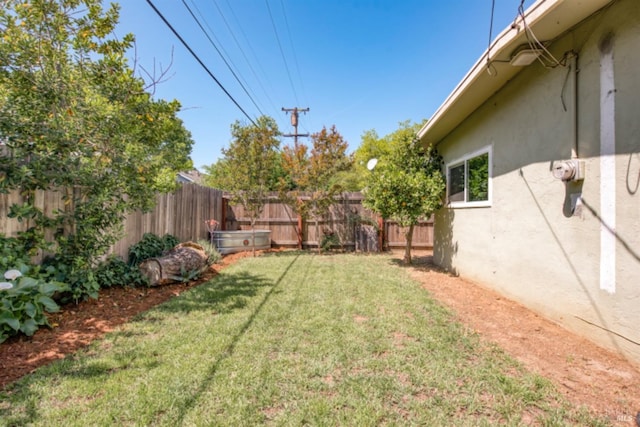 view of yard featuring a fenced backyard