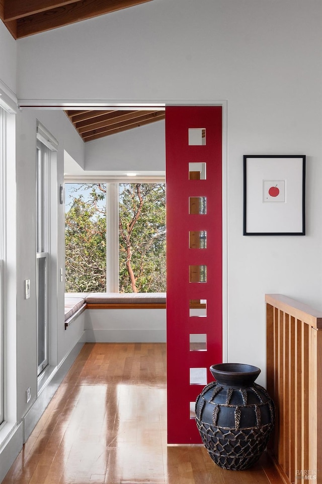 interior space with wooden ceiling, lofted ceiling, and wood finished floors
