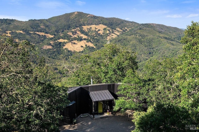 mountain view featuring a wooded view