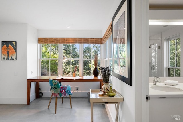 sunroom featuring a sink