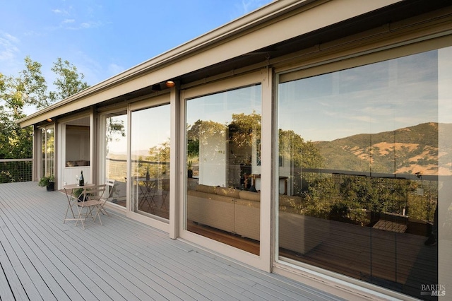 wooden terrace with a mountain view