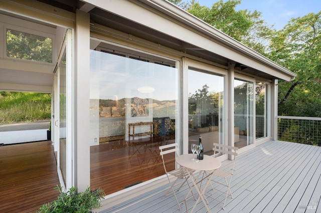 deck with a sunroom