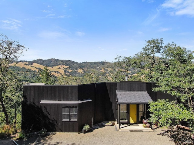 exterior space featuring a mountain view