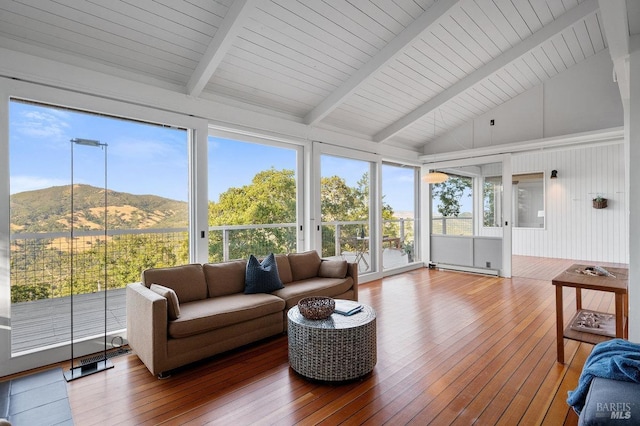 sunroom featuring a baseboard radiator, beam ceiling, wood-type flooring, and high vaulted ceiling