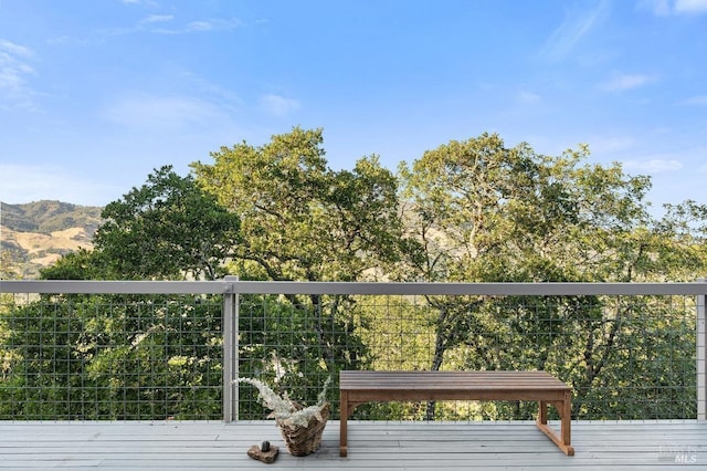wooden deck with a mountain view