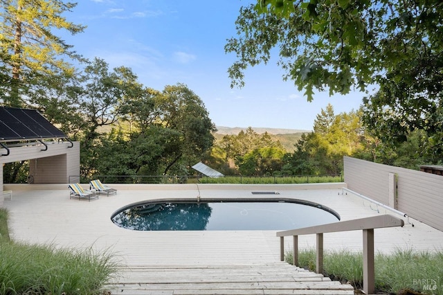 view of swimming pool with a patio and a fenced in pool