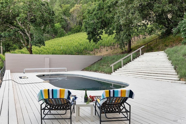 view of pool with a deck