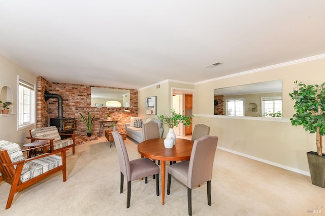 2555 Edgewater Dr, Napa, CA 94558 - dining room featuring a wood stove, plenty of natural light, visible vents, and light colored carpet