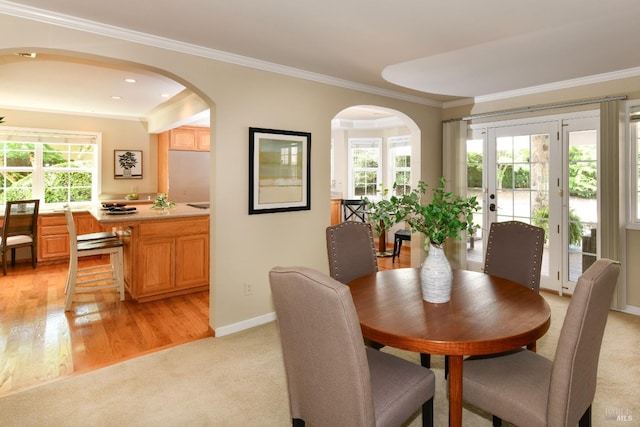 2555 Edgewater Dr, Napa, CA 94558 - dining space with crown molding, plenty of natural light, baseboards, and arched walkways