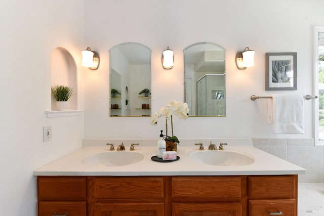 2555 Edgewater Dr, Napa, CA 94558 - bathroom with a shower stall, a healthy amount of sunlight, double vanity, and a sink