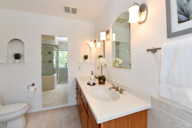 2555 Edgewater Dr, Napa, CA 94558 - bathroom featuring a sink, toilet, visible vents, a stall shower, and double vanity