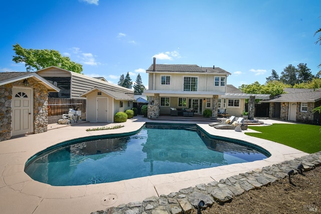 2555 Edgewater Dr, Napa, CA 94558 - outdoor pool with an outbuilding, fence, a patio area, and a shed