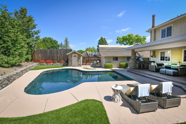 2555 Edgewater Dr, Napa, CA 94558 - view of swimming pool featuring an outdoor living space, an outbuilding, a patio, a storage shed, and a fenced backyard