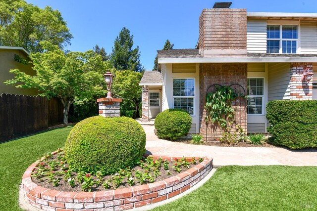 2555 Edgewater Dr, Napa, CA 94558 - exterior space featuring a chimney, fence, and a front yard