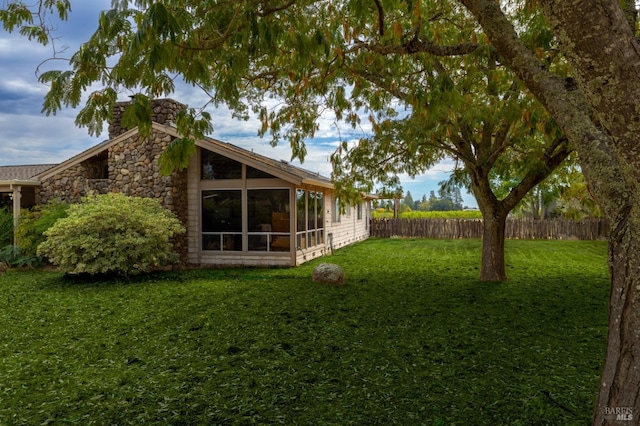 1851 Vallejo St, Saint Helena, CA 94574 - back of property featuring a sunroom, a yard, fence, and stone siding