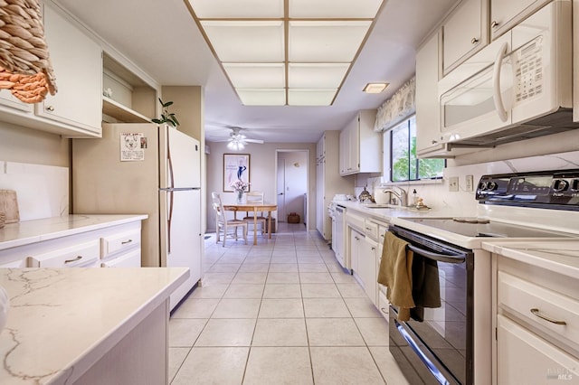 kitchen with white cabinetry, a ceiling fan, a sink, and white appliances