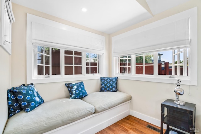 sitting room featuring baseboards, visible vents, recessed lighting, and wood finished floors
