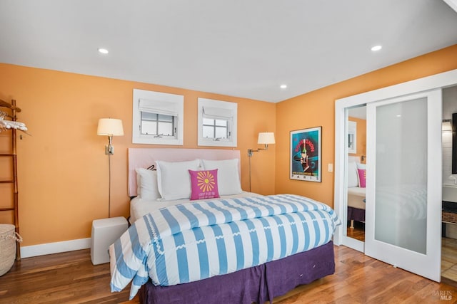 bedroom featuring recessed lighting, baseboards, and wood finished floors