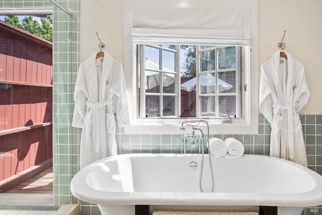 bathroom featuring a freestanding bath