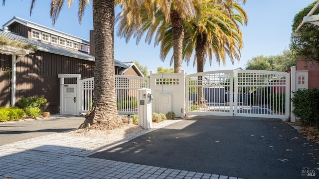 view of gate featuring fence