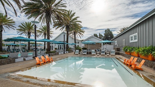 pool with a patio area
