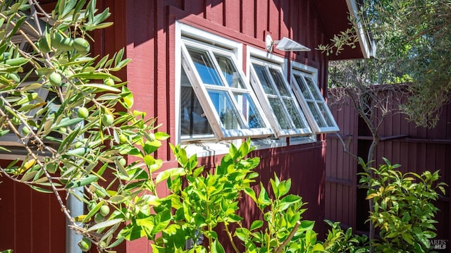view of home's exterior with fence
