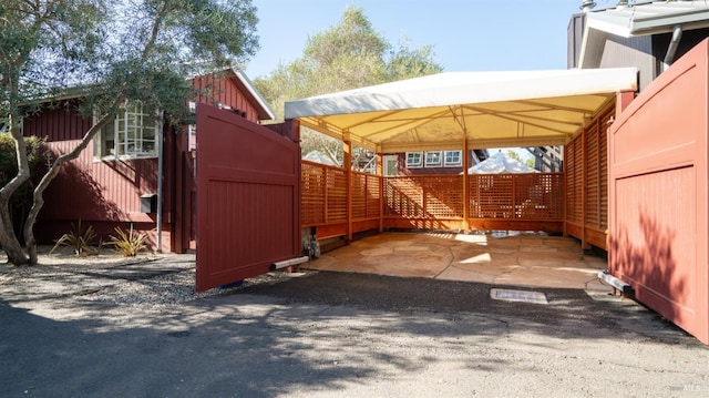 view of parking / parking lot featuring a detached carport