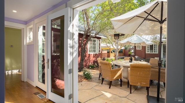exterior space featuring french doors and visible vents