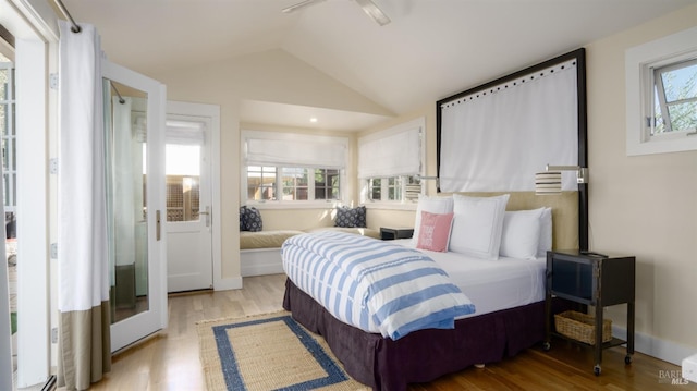 bedroom with vaulted ceiling, a ceiling fan, and wood finished floors
