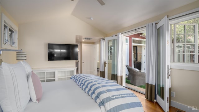 bedroom with wood finished floors, visible vents, vaulted ceiling, ceiling fan, and access to exterior